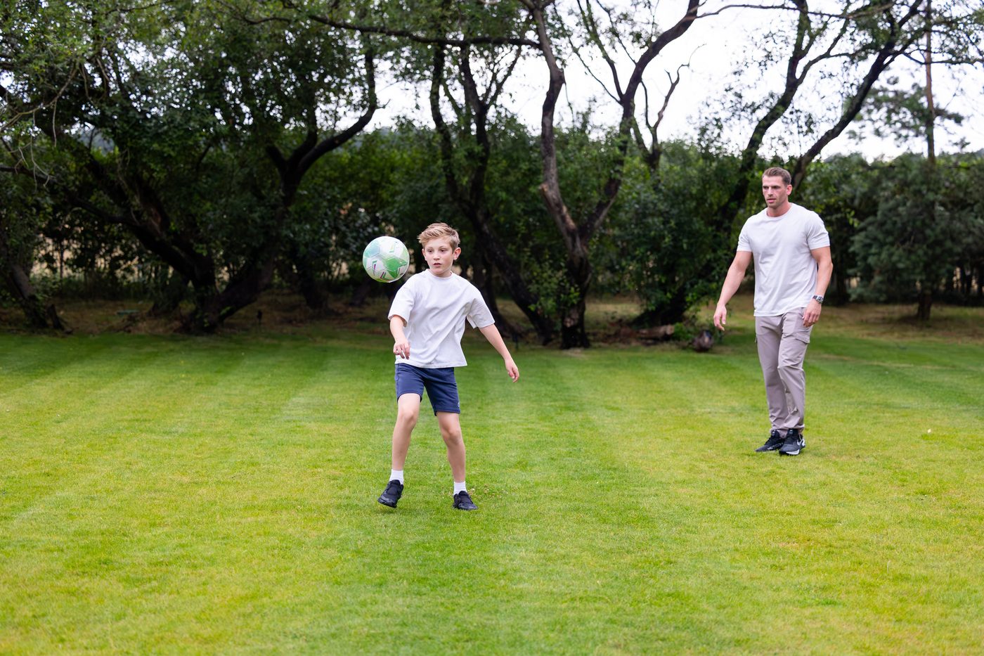A kickabout on the big lawn at Warren House