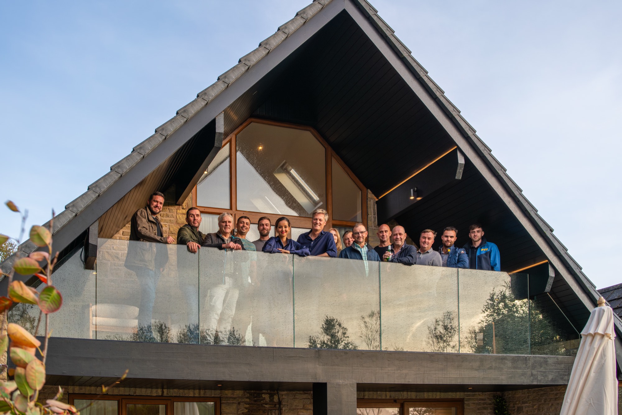 A group of friends together on the balcony at Warren House